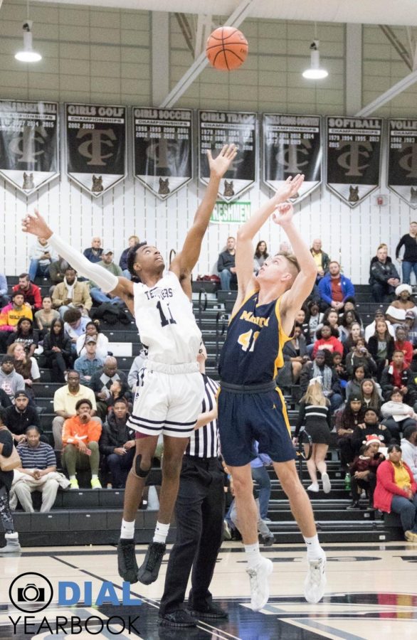 Davaris Macklin (11) and Matt Cook (41)jumping for the ball at the start of the game.