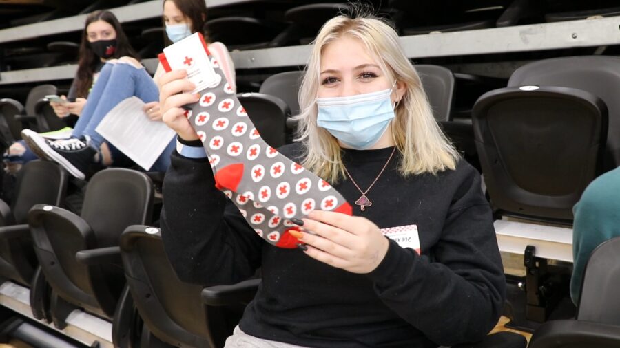 Catherine Lee showing off her socks from the American Red Cross.