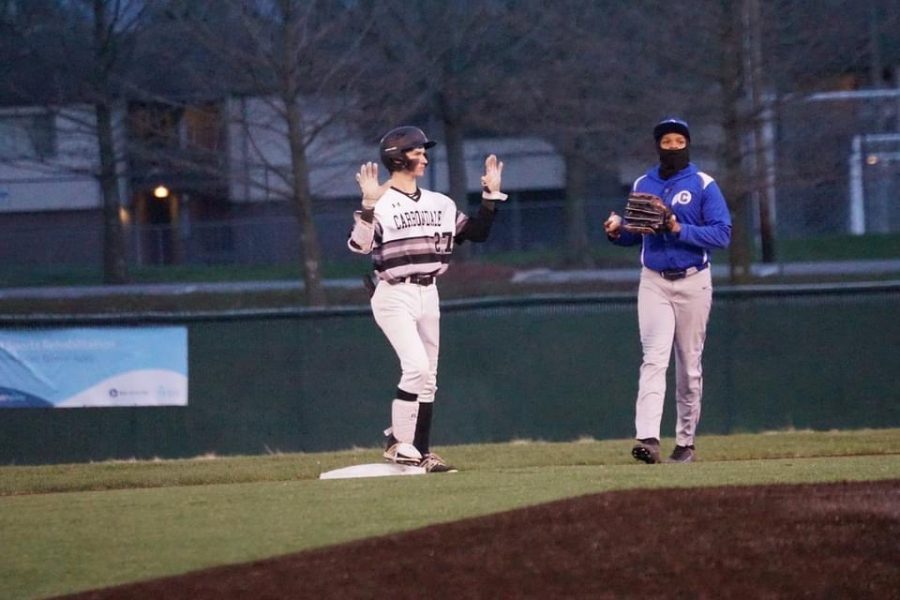 Photo taken by Christine Chance. Senior Tommy Rushing asks for time after smoking a double to right-center.