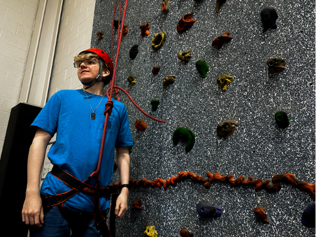 Preparing+to+climb+the+rockwall%2C+senior+Andrew+Shafer+of+CCHS+looks+back+to+his+belayer+to+double+check+that+the+belay+is+ready+for+him+to+start+climbing.+To+ensure+his+safety%2C+he+fastens+the+harness+and+communicates+with+his+partner.