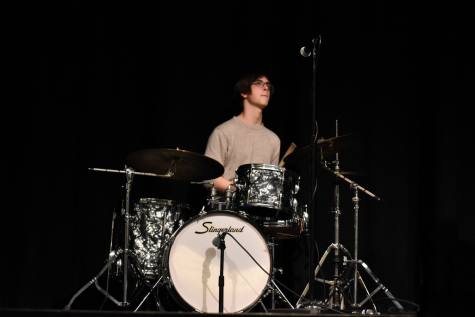 Photo taken by Joslyn Woods. Sam Byrd practicing on the drums during rehearsal.