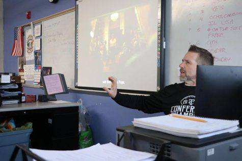 Coach Lee explaining a movie to his 6th hour class. Photo taken by NiaMarie Collier. 