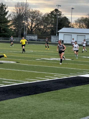Mkenna Hickey running to try and score for her team. Photo taken by Javion Kizer. 