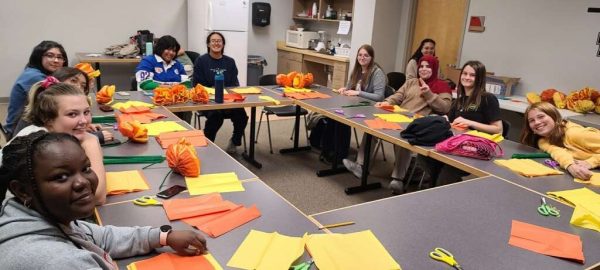 Carbondale Community High Schools International Club making paper marigolds.
