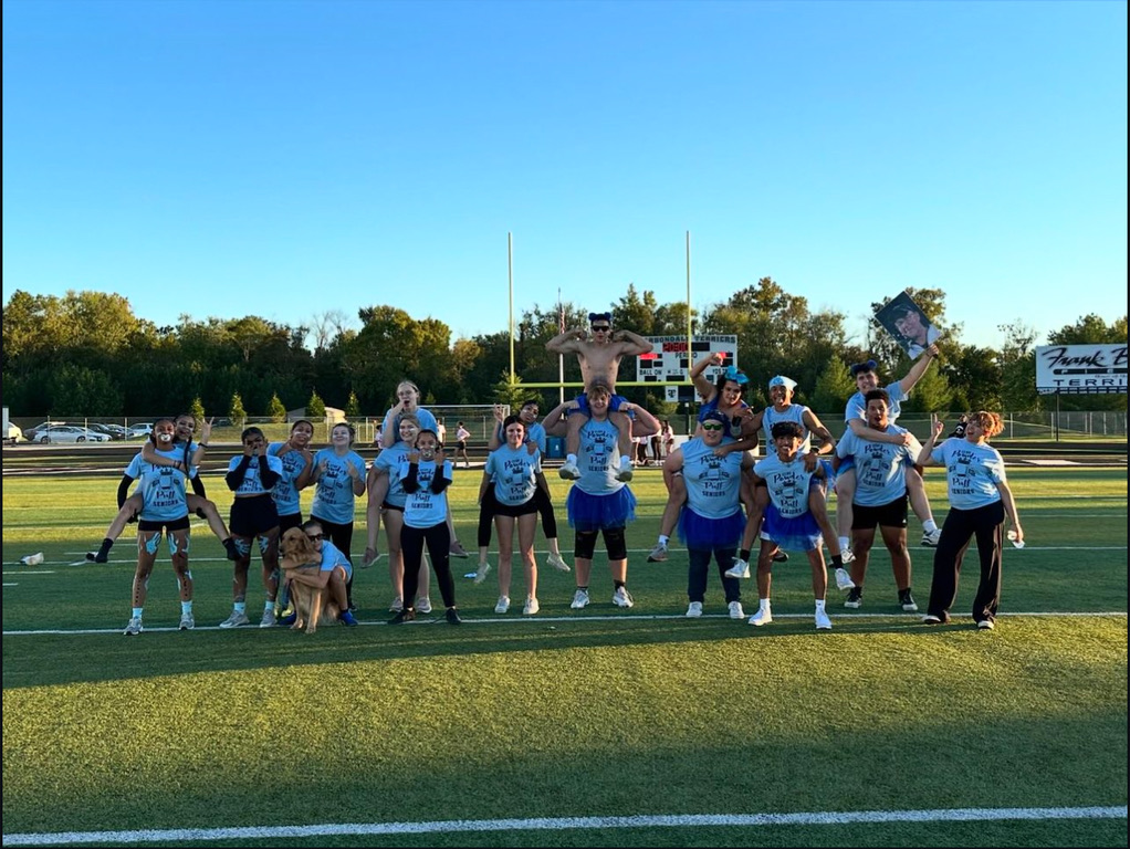 Senior Powderpuff team poses for a group picture before the game.