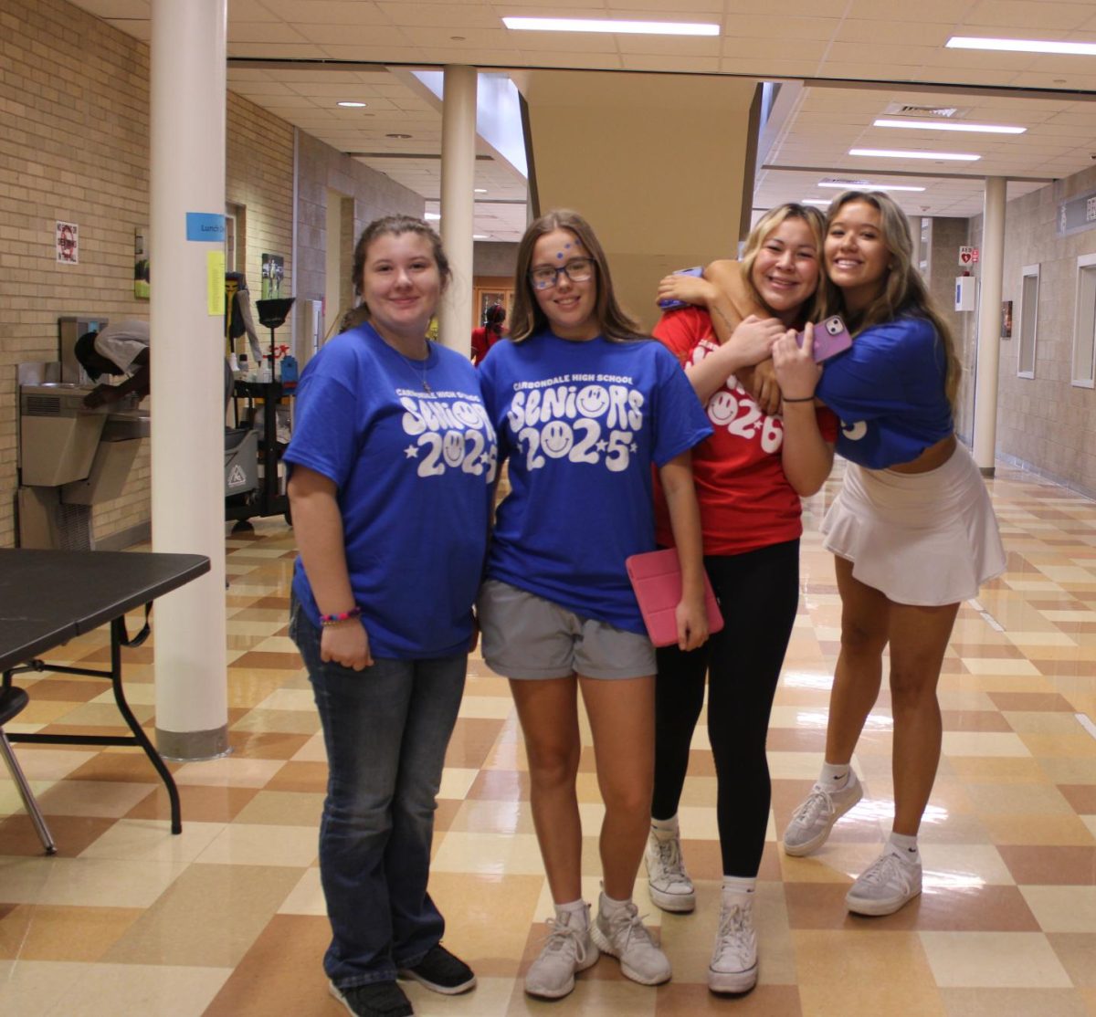 Seniors at CCHS showing off their class color day shirts 