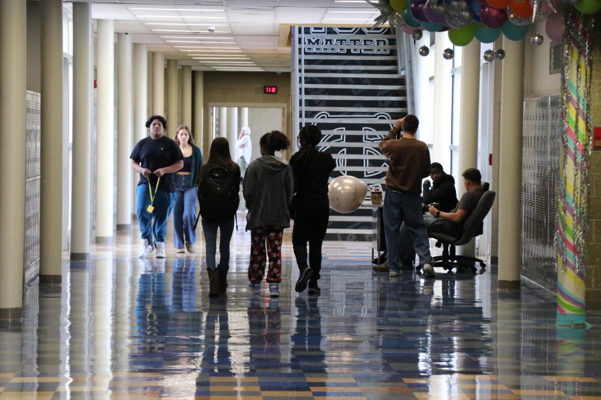 Several CCHS journalism students practicing taking pictures during the class period. 