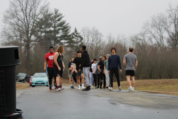 Football team warmups outside of the weight room