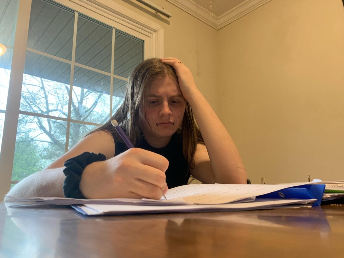 (Carbondale Community High School Senior Aodhan Anz stumped on homework.)