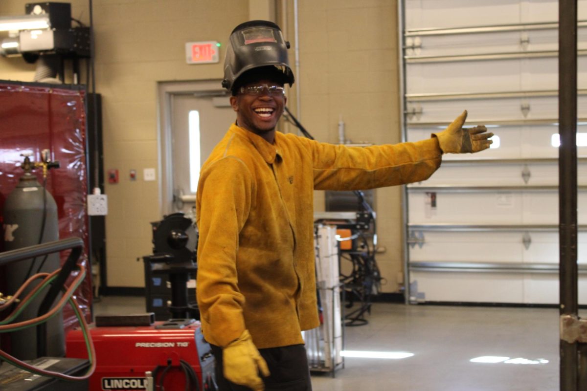 "Senior, Mikaden Greene smiling in 6th hour welding 2."