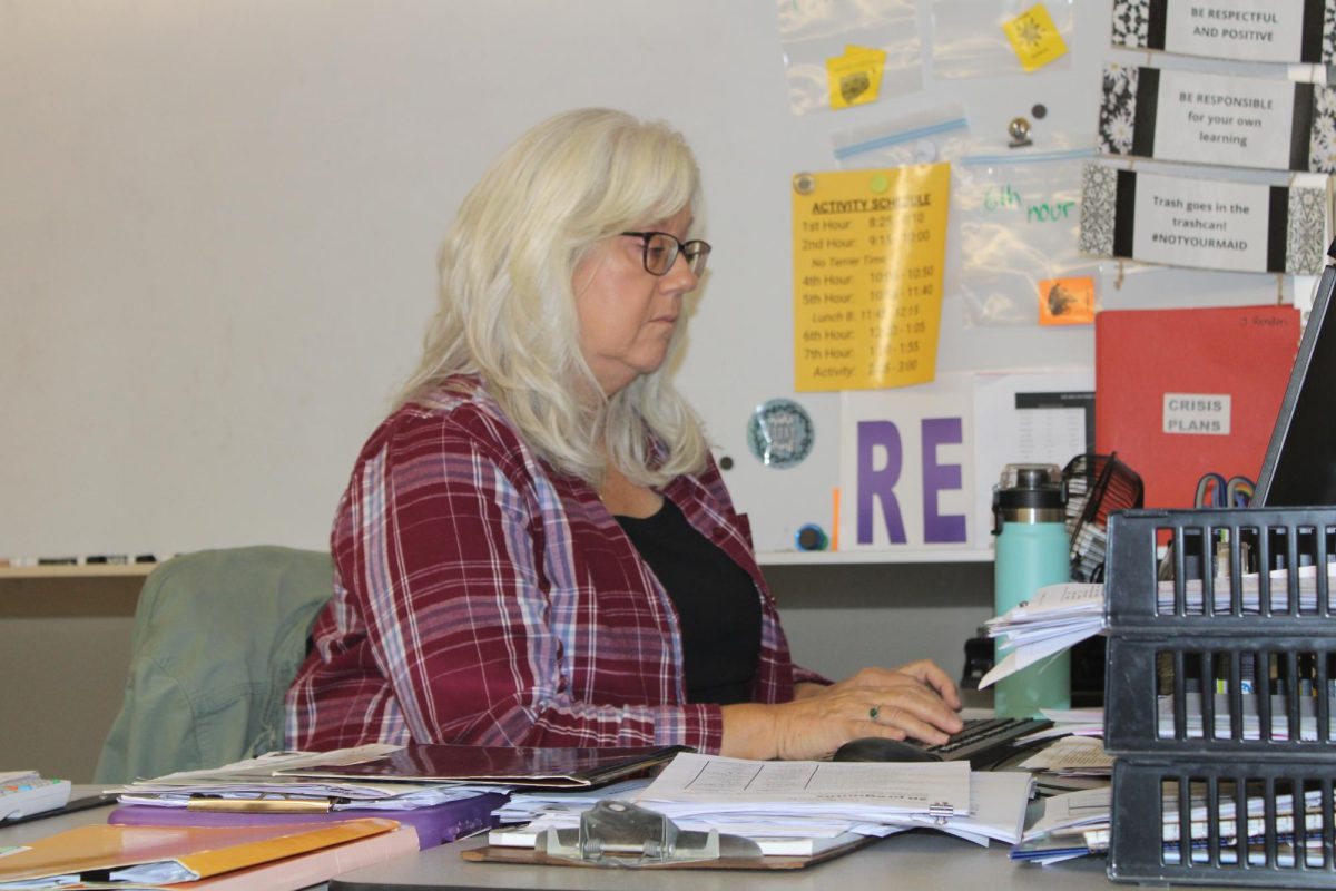 Mrs. Rendon working at her desk.